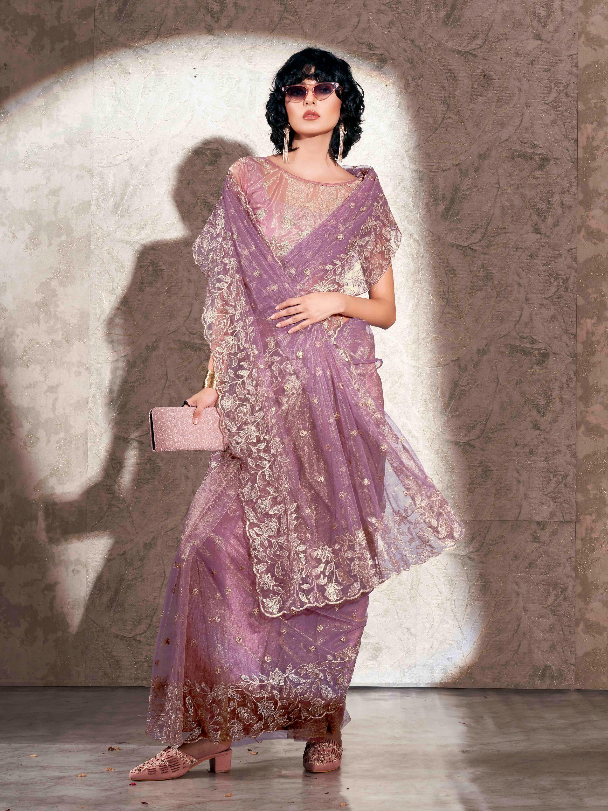 Lavendar colored shimmer net saree with jari embroidery scalloped border and faux diamonds