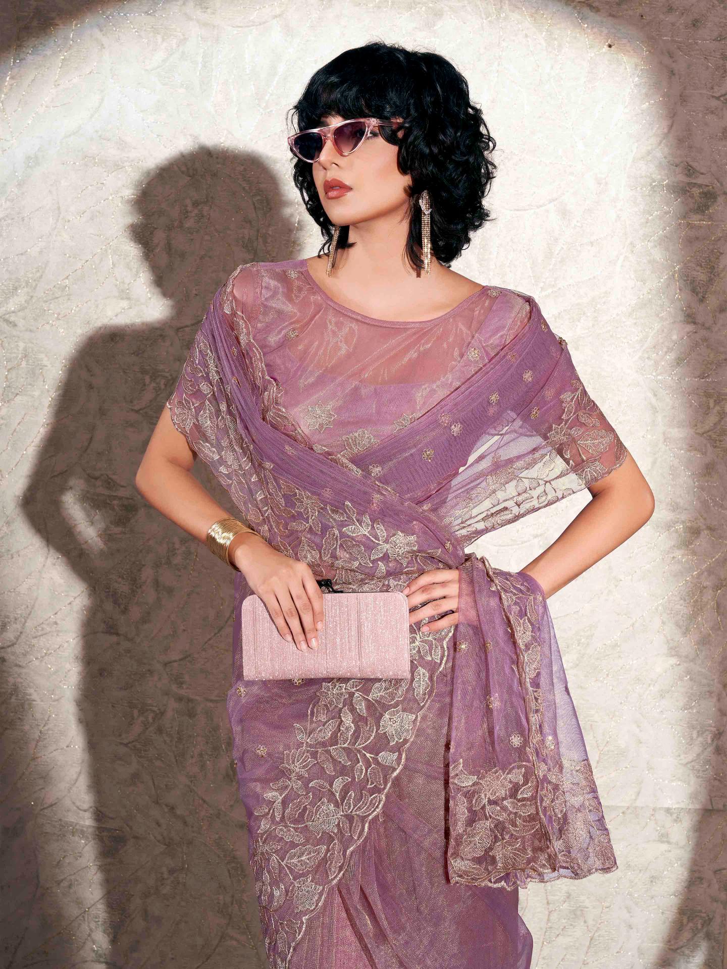 Lavendar colored shimmer net saree with jari embroidery scalloped border and faux diamonds