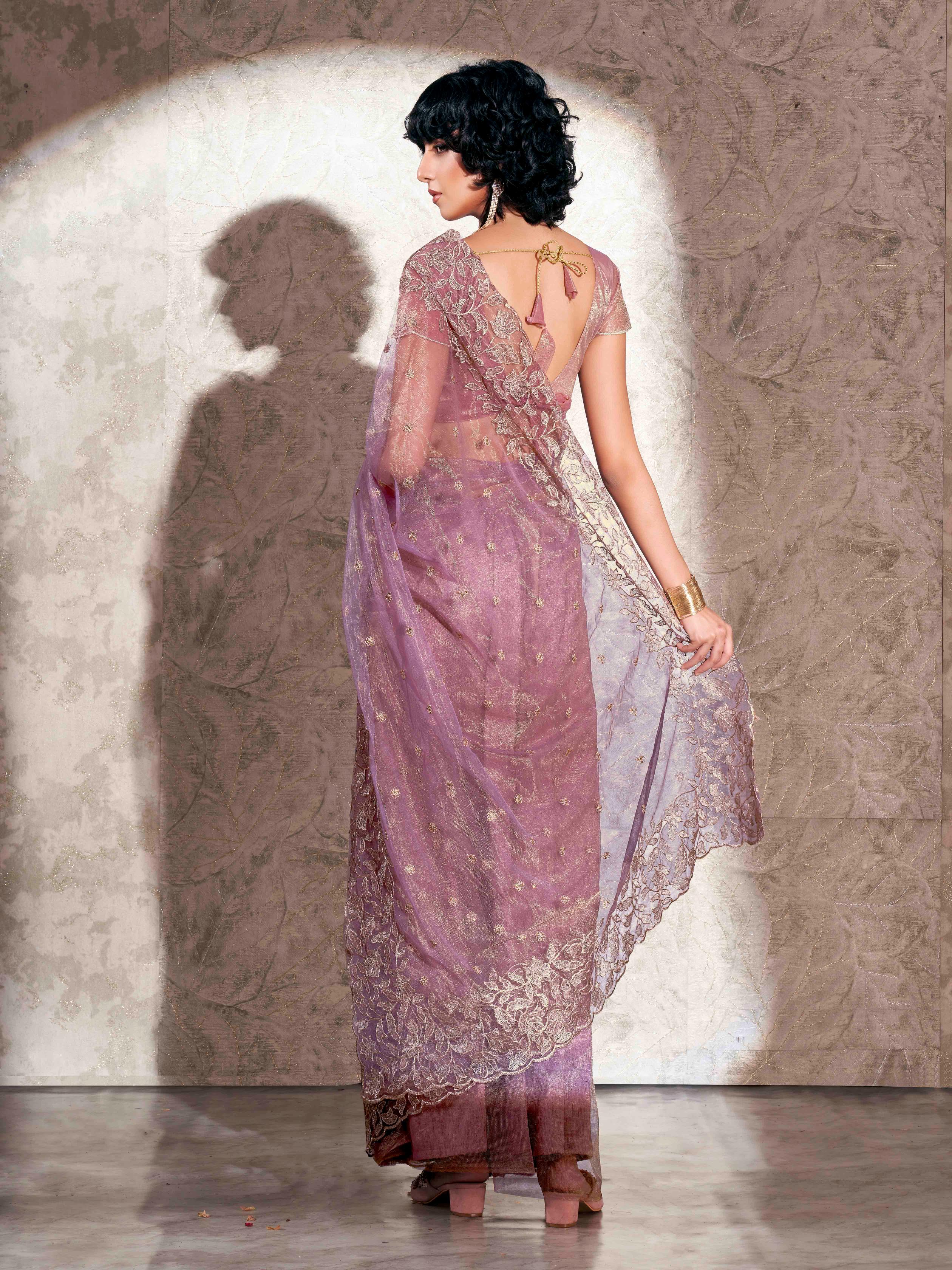 Lavendar colored shimmer net saree with jari embroidery scalloped border and faux diamonds