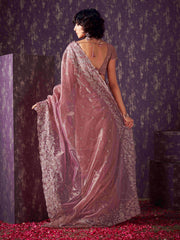 Pink colored shimmer net saree with jari embroidery scalloped border and faux diamonds