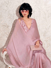 Pink colored satin chiffon saree with tassles and satin printed pleated blouse