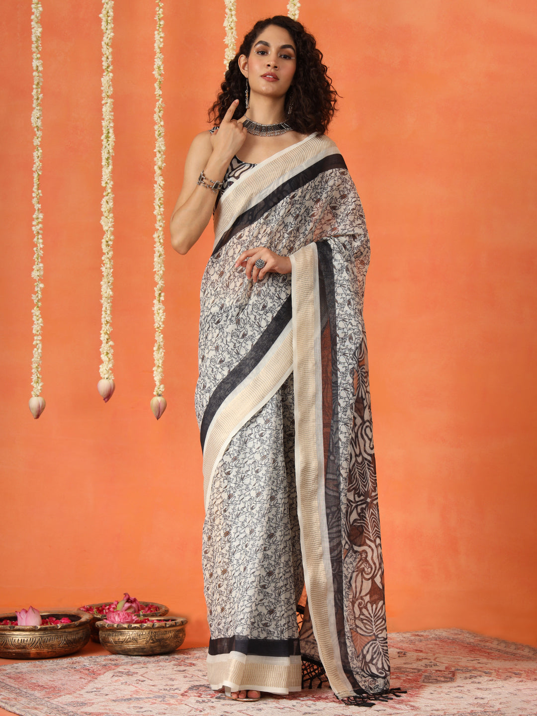 Beige and mustard colored cotton blend digital printed striped saree with tassles