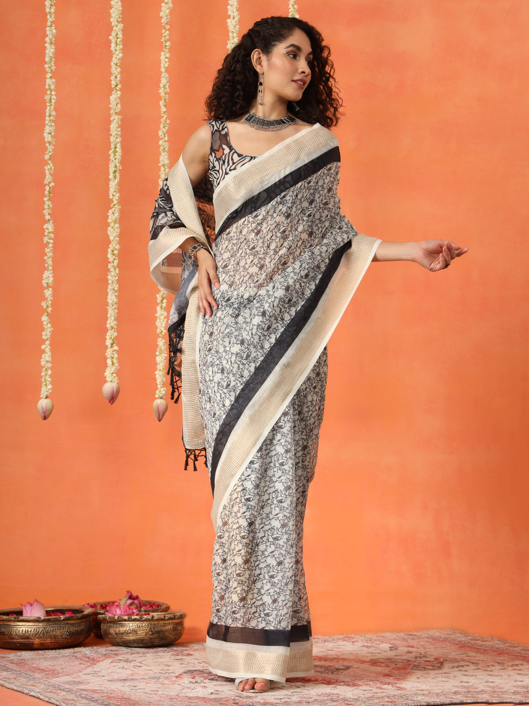 Beige and mustard colored cotton blend digital printed striped saree with tassles