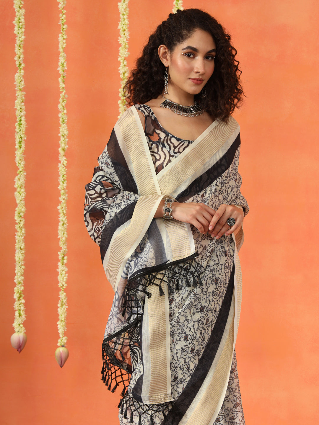 Beige and mustard colored cotton blend digital printed striped saree with tassles