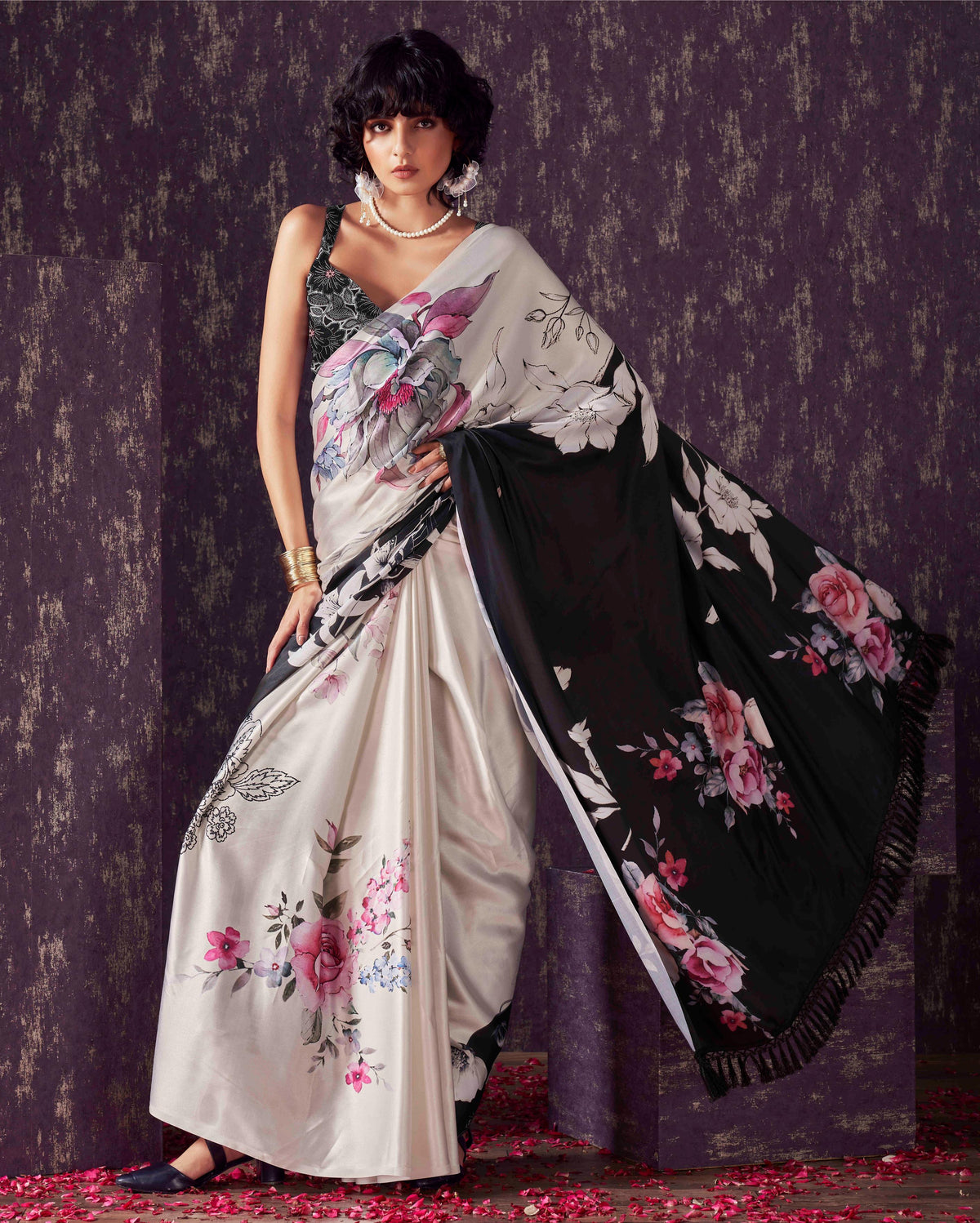 Two ways wearable cream and black colored digital printed floral satin saree with tassles