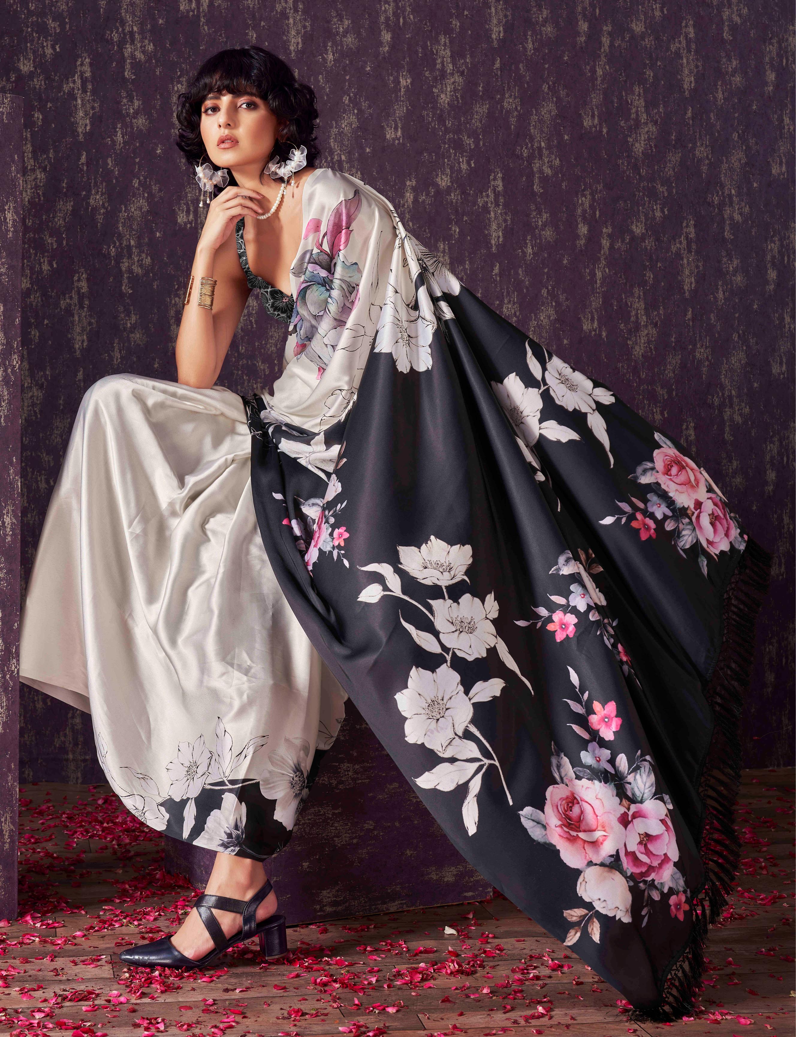 Two ways wearable cream and black colored digital printed floral satin saree with tassles