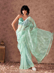 Sea Green colored half and half sequin embroidered net saree with embellished lace