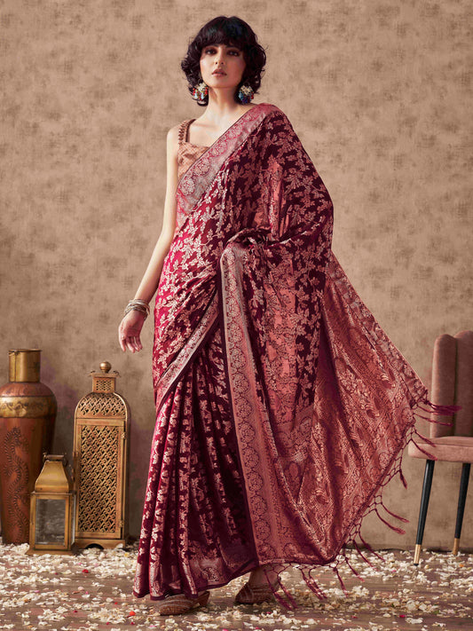 Magenta colored woven designer saree with rich pallu and tassles