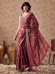 Magenta colored woven designer saree with rich pallu and tassles