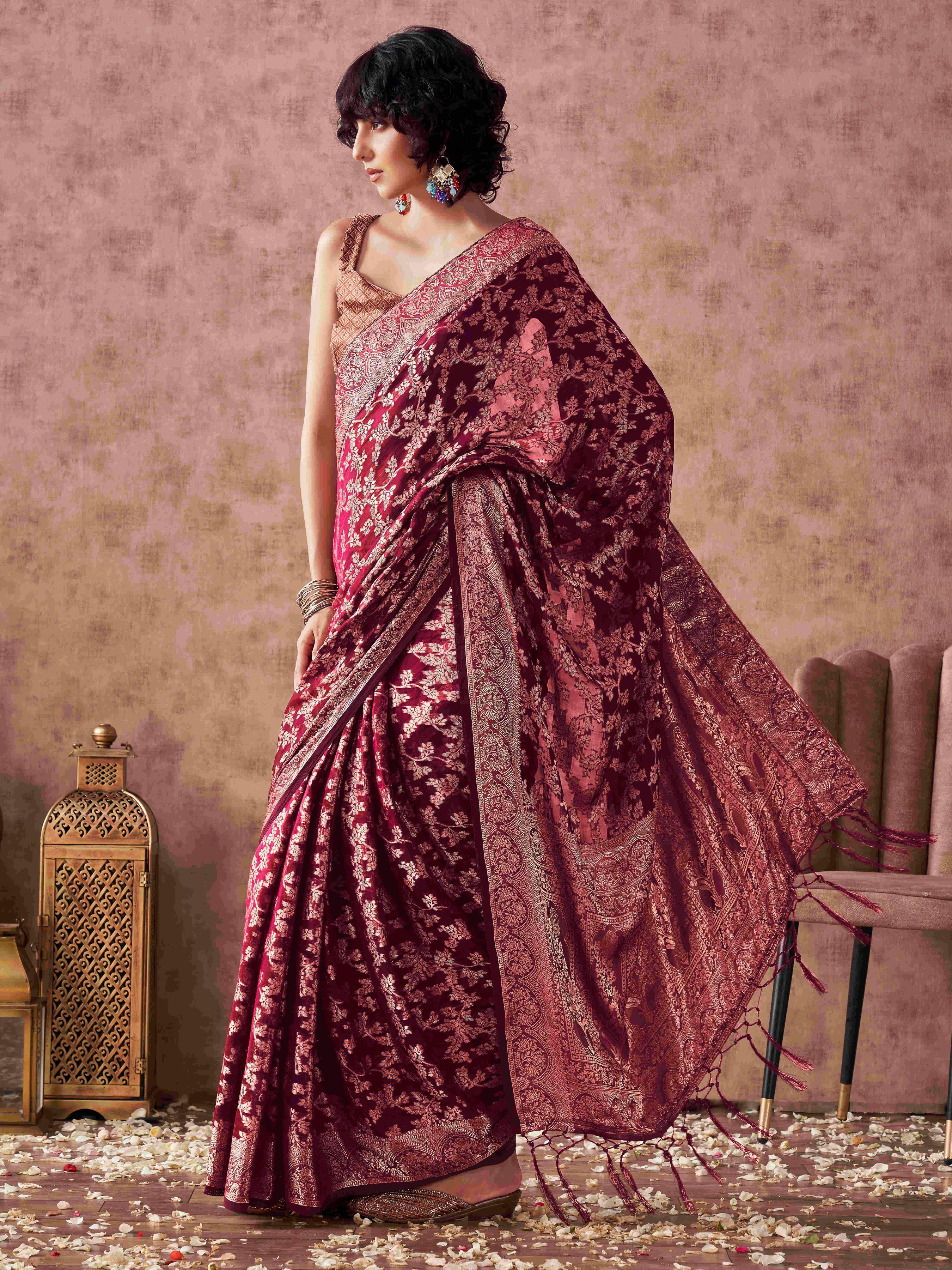 Magenta colored woven designer saree with rich pallu and tassles