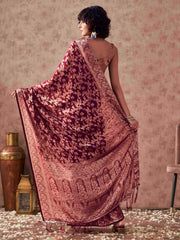 Magenta colored woven designer saree with rich pallu and tassles