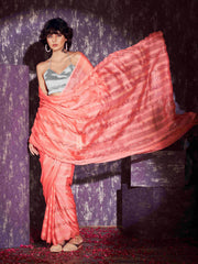 Peach colored satin striped saree with sequence embroidery and scalloped border