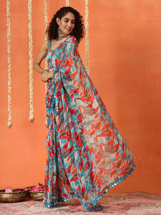 Blue and red colored georgette saree with faux mirror embroiderd scalloped lace