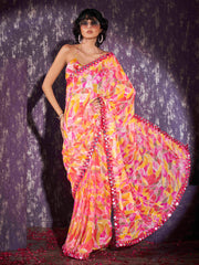 Pink and yellow colored georgette saree with faux mirror embroiderd scalloped lace