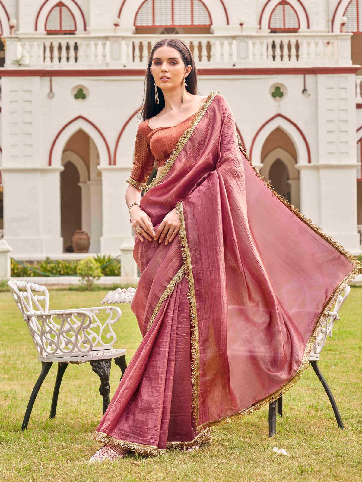 Pink colored crushed organza saree with designer lace and brocade blouse