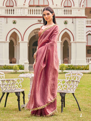 Pink colored crushed organza saree with designer lace and brocade blouse