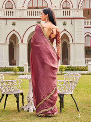 Pink colored crushed organza saree with designer lace and brocade blouse