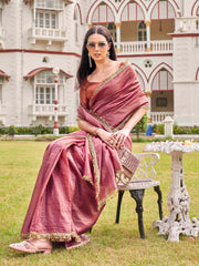 Pink colored crushed organza saree with designer lace and brocade blouse