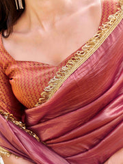 Pink colored crushed organza saree with designer lace and brocade blouse