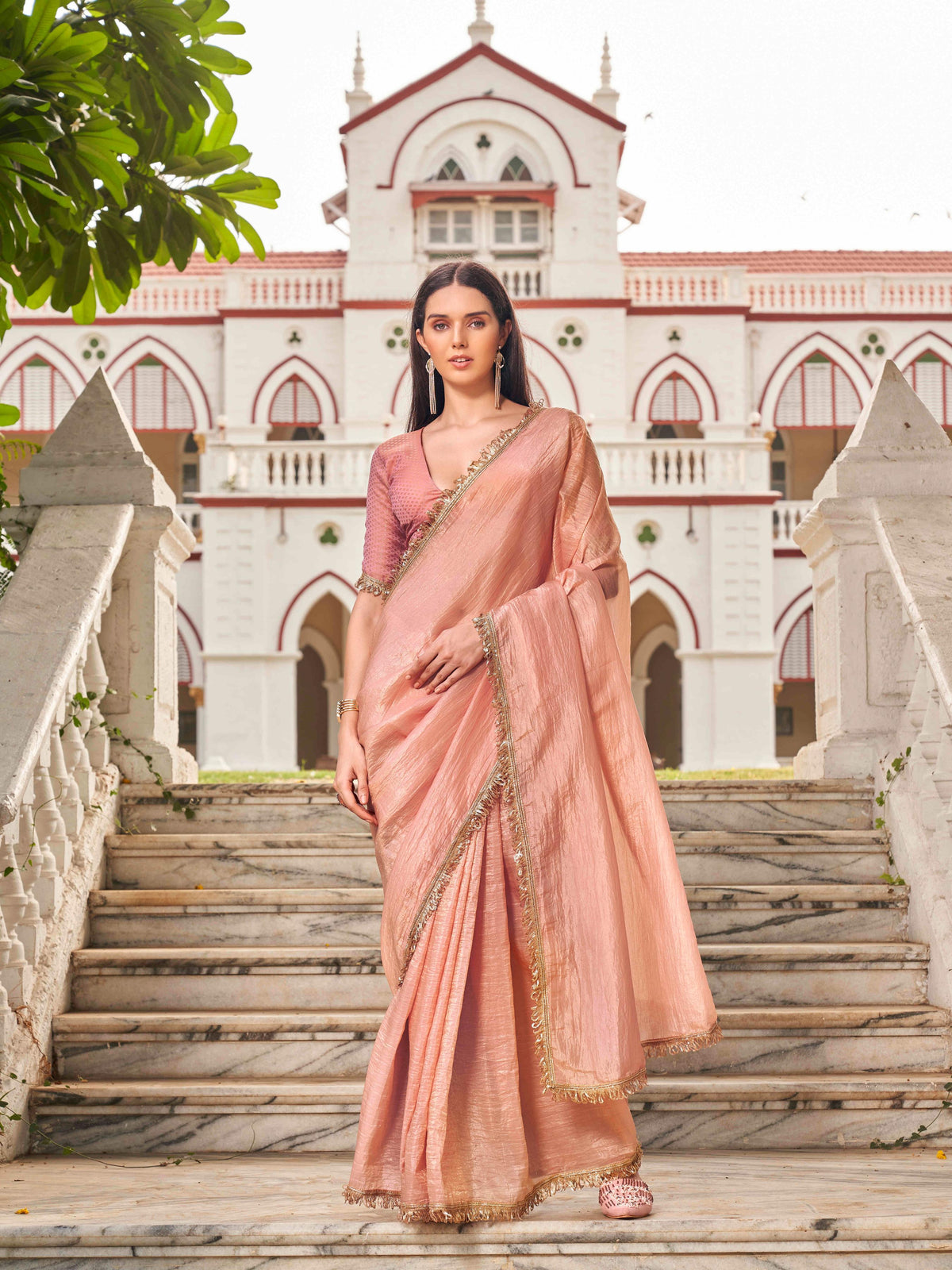 Peach colored crushed organza saree with designer lace and brocade blouse