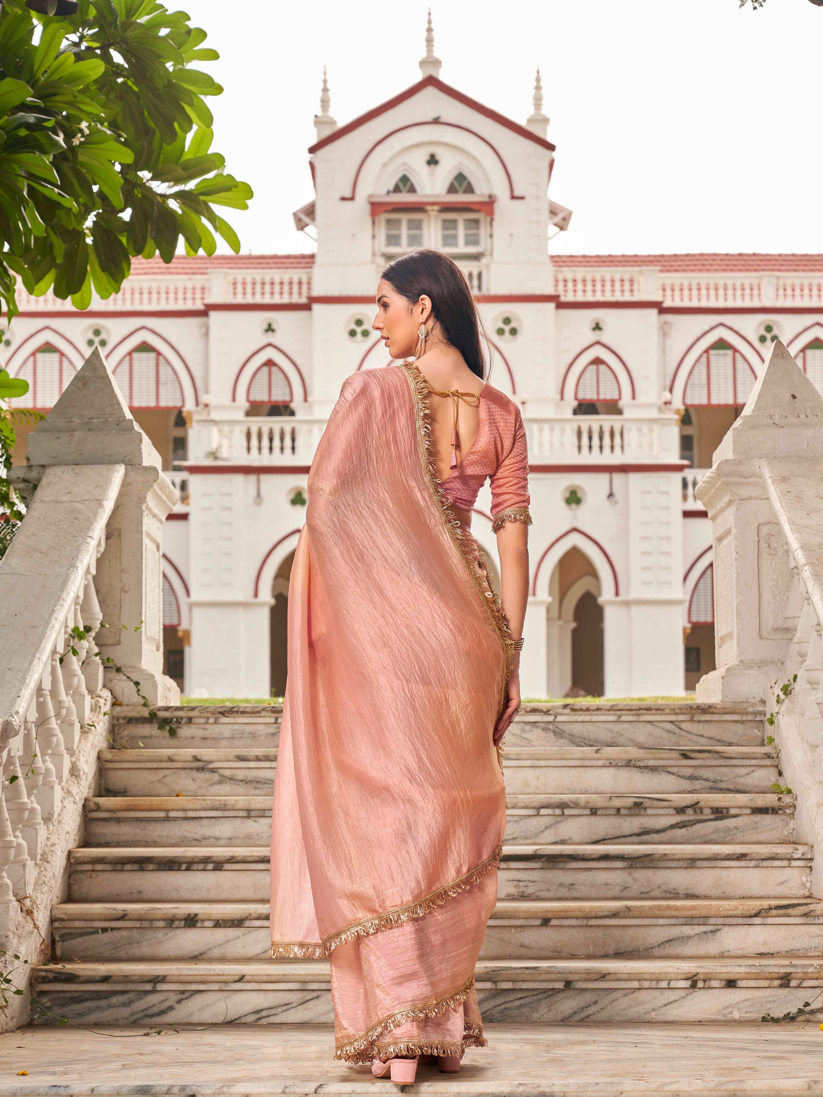 Peach colored crushed organza saree with designer lace and brocade blouse