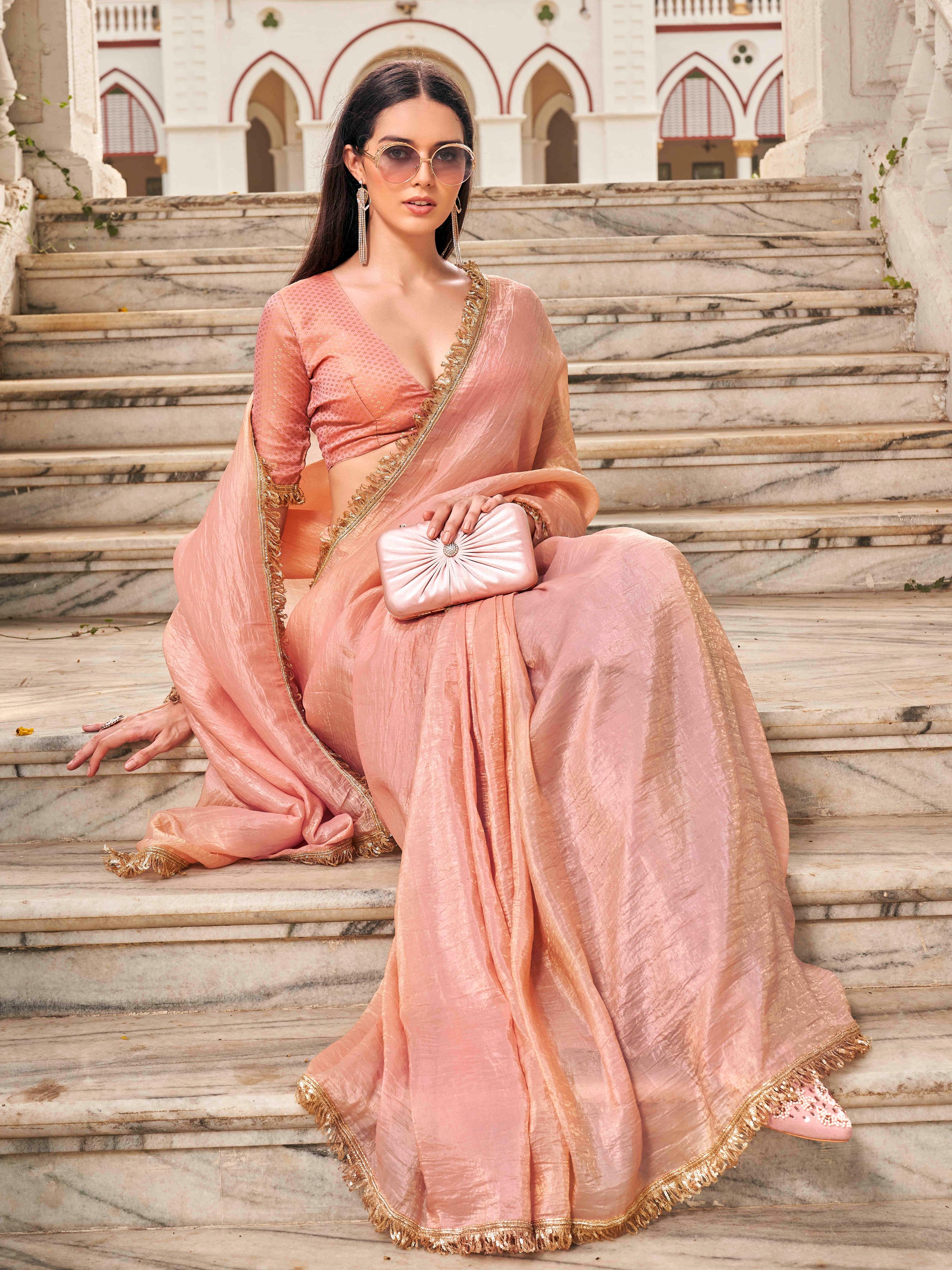 Peach colored crushed organza saree with designer lace and brocade blouse