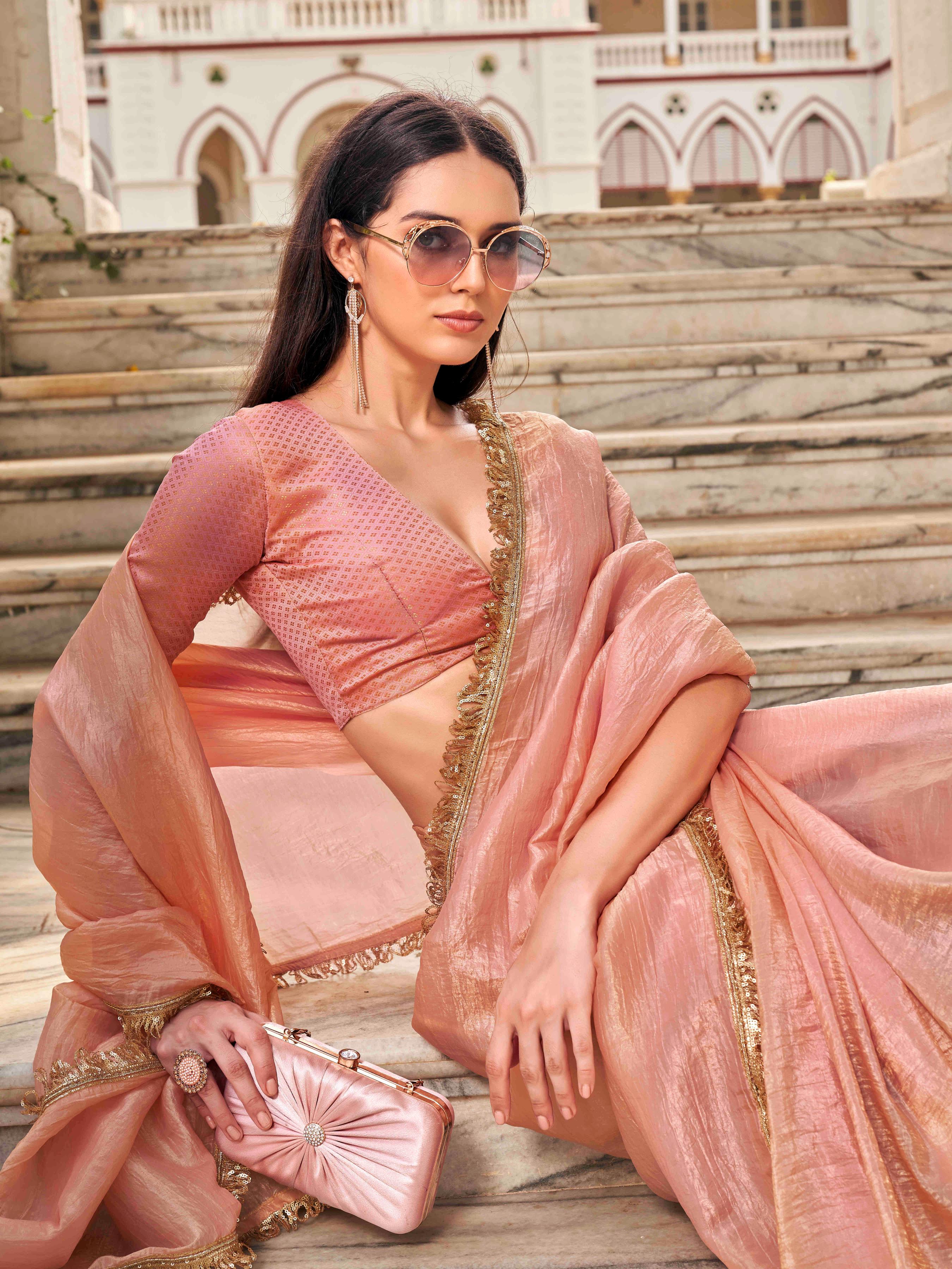 Peach colored crushed organza saree with designer lace and brocade blouse