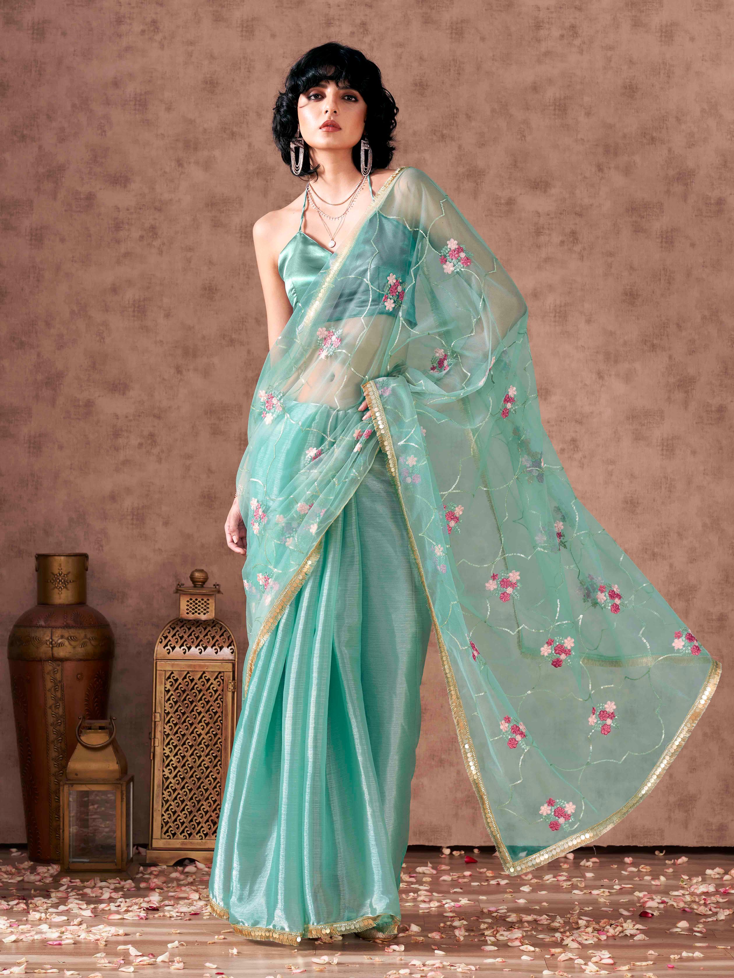 Half and half sea green colored net and satin chiffon sequined embroidered saree with designer lace