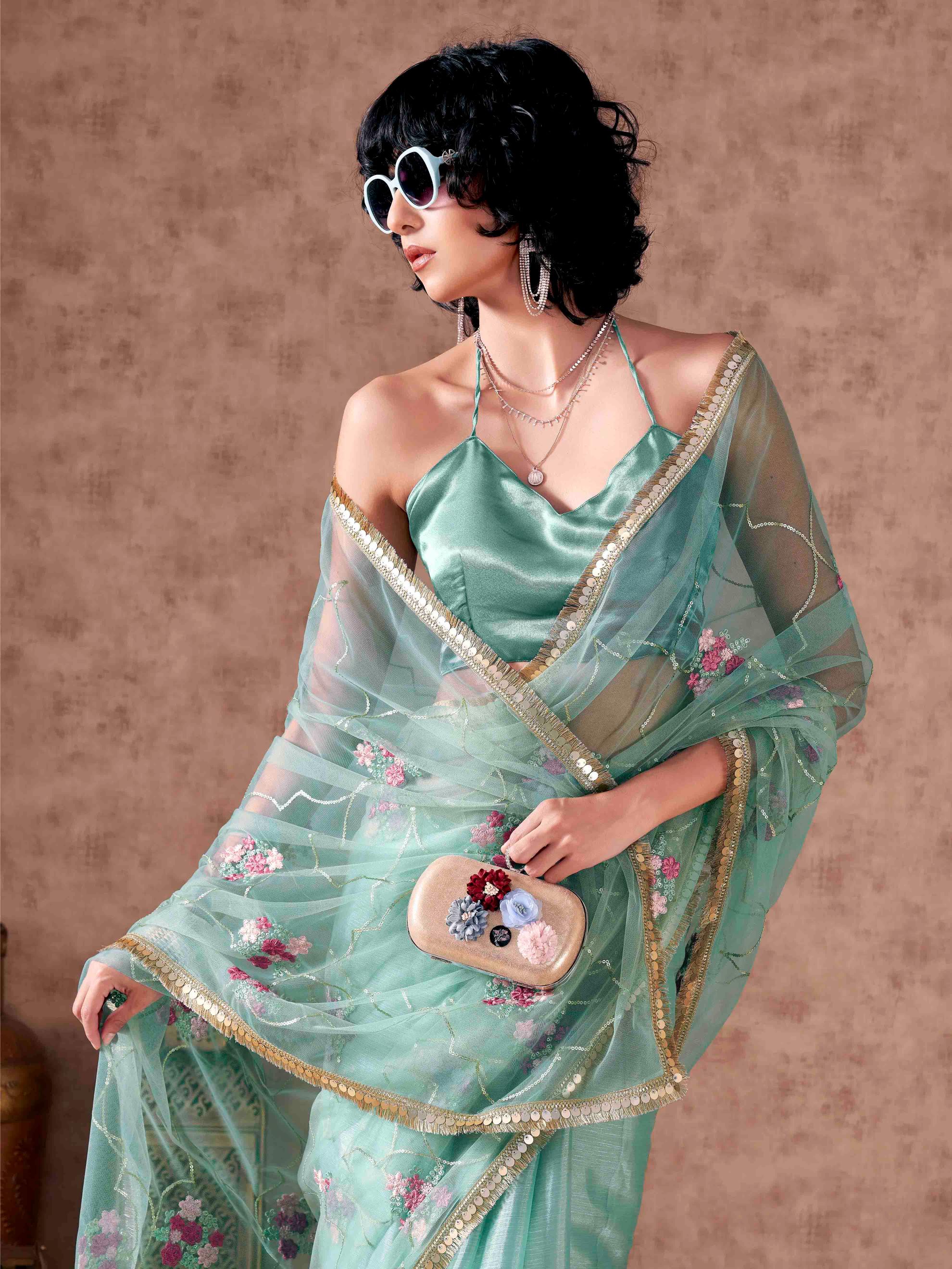 Half and half sea green colored net and satin chiffon sequined embroidered saree with designer lace