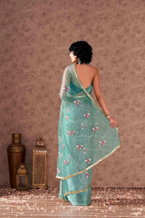 Half and half sea green colored net and satin chiffon sequined embroidered saree with designer lace