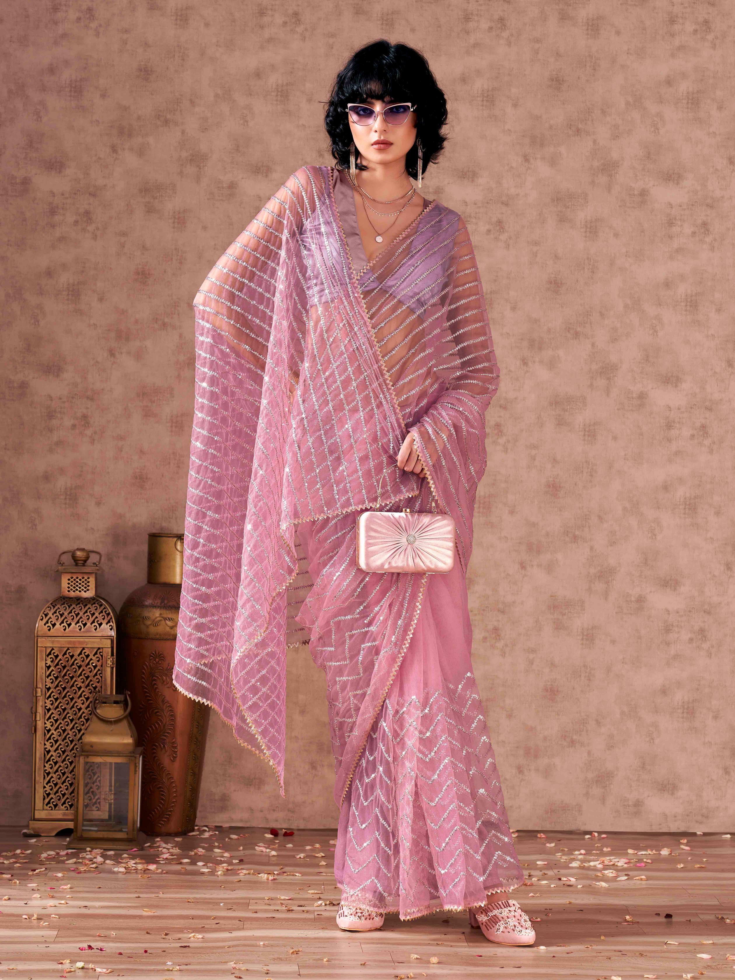 Pink colored heavy sequined embroidered net saree with gota patti lace