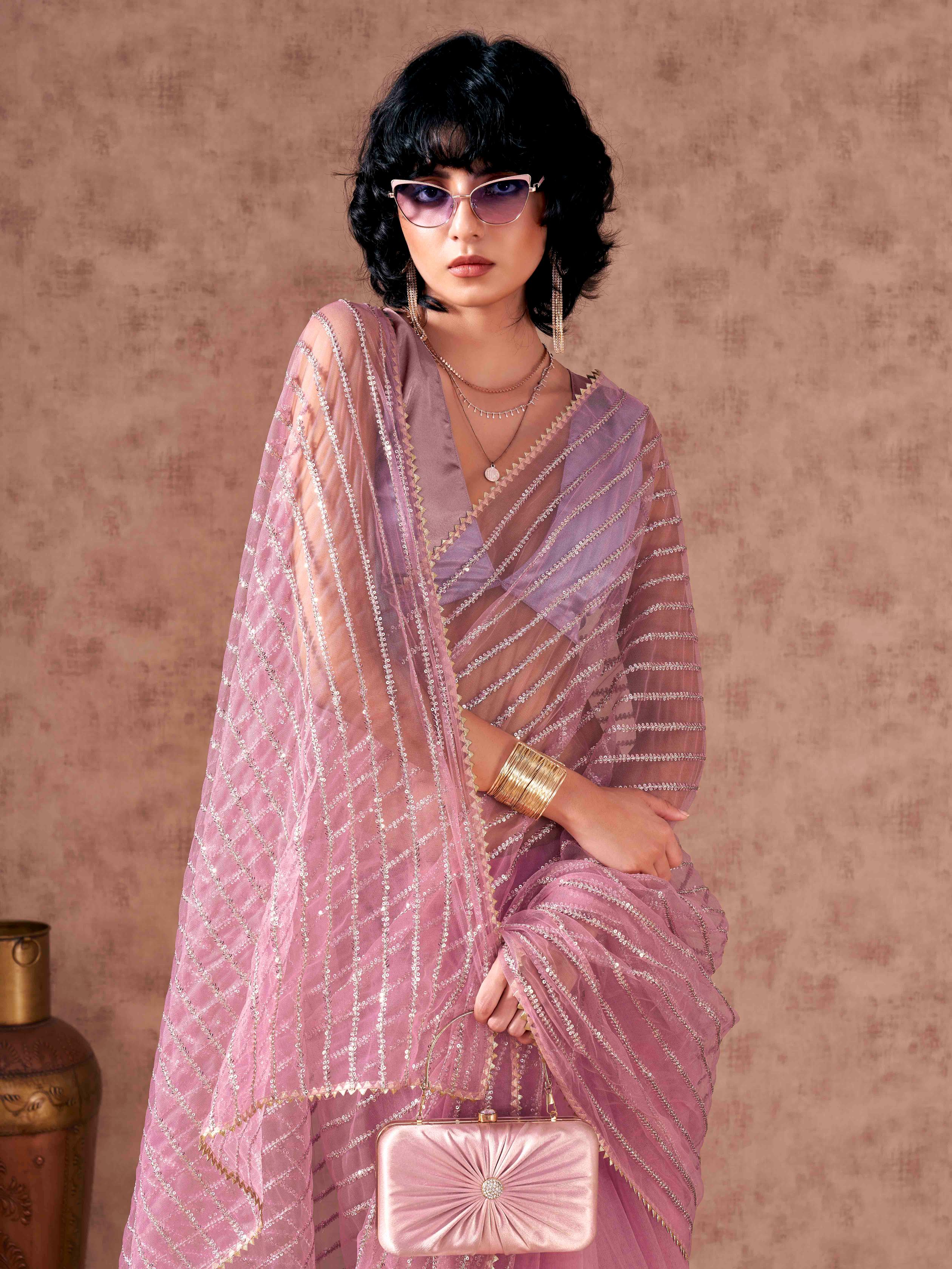 Pink colored heavy sequined embroidered net saree with gota patti lace