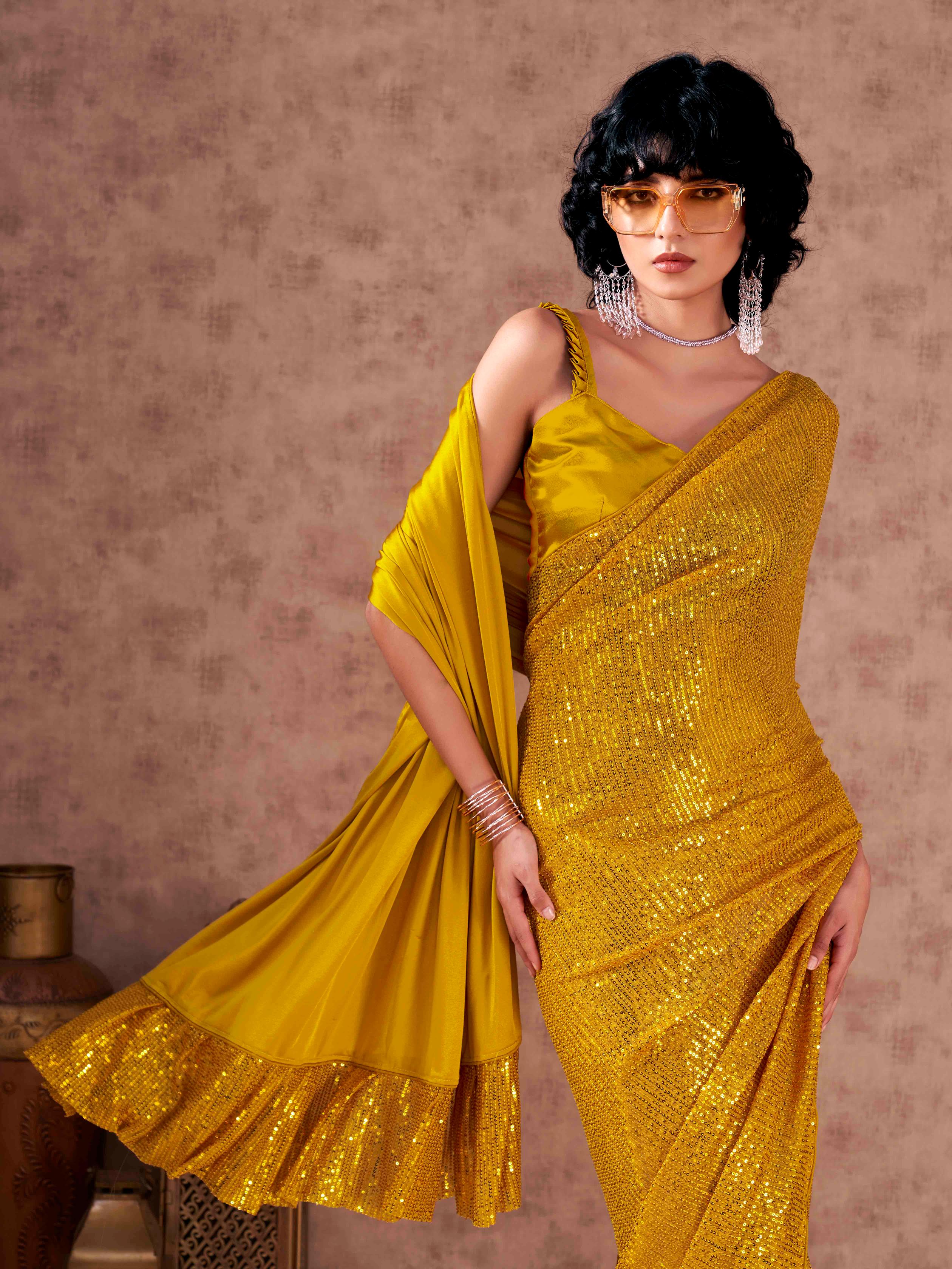 Half and Half yellow colored sequined lycra saree