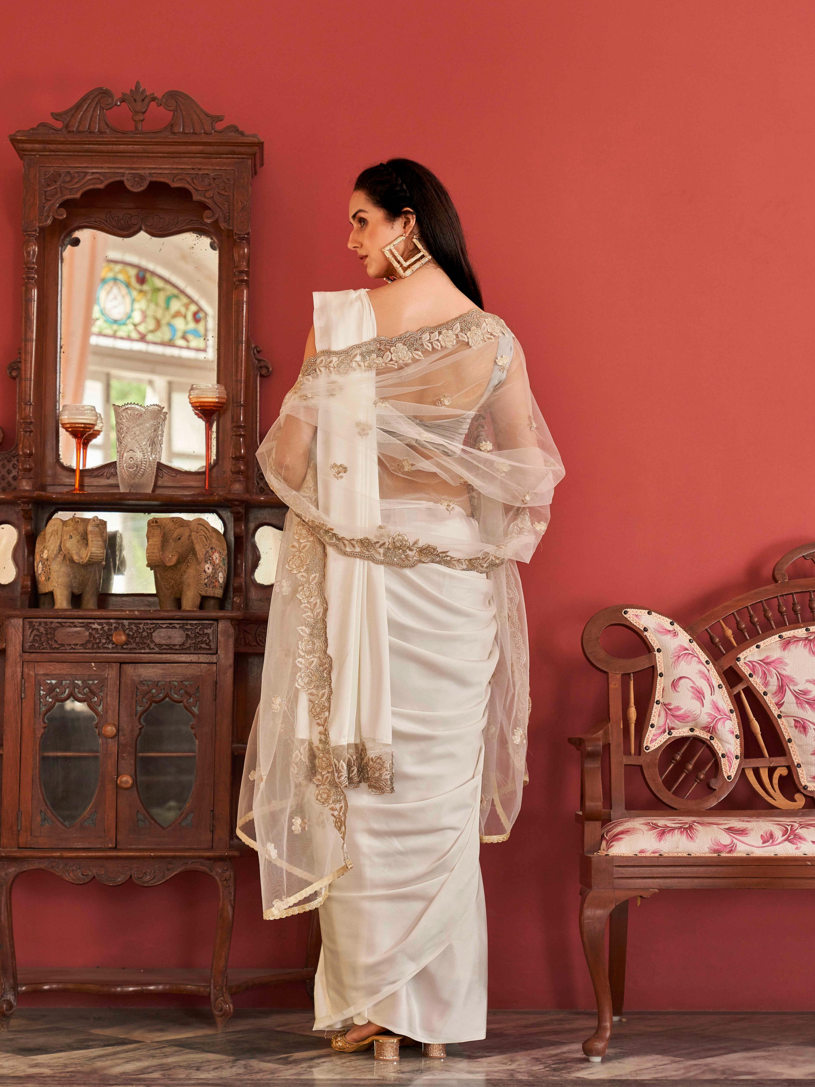 White colored designer saree with dupatta which can be draped multiple ways