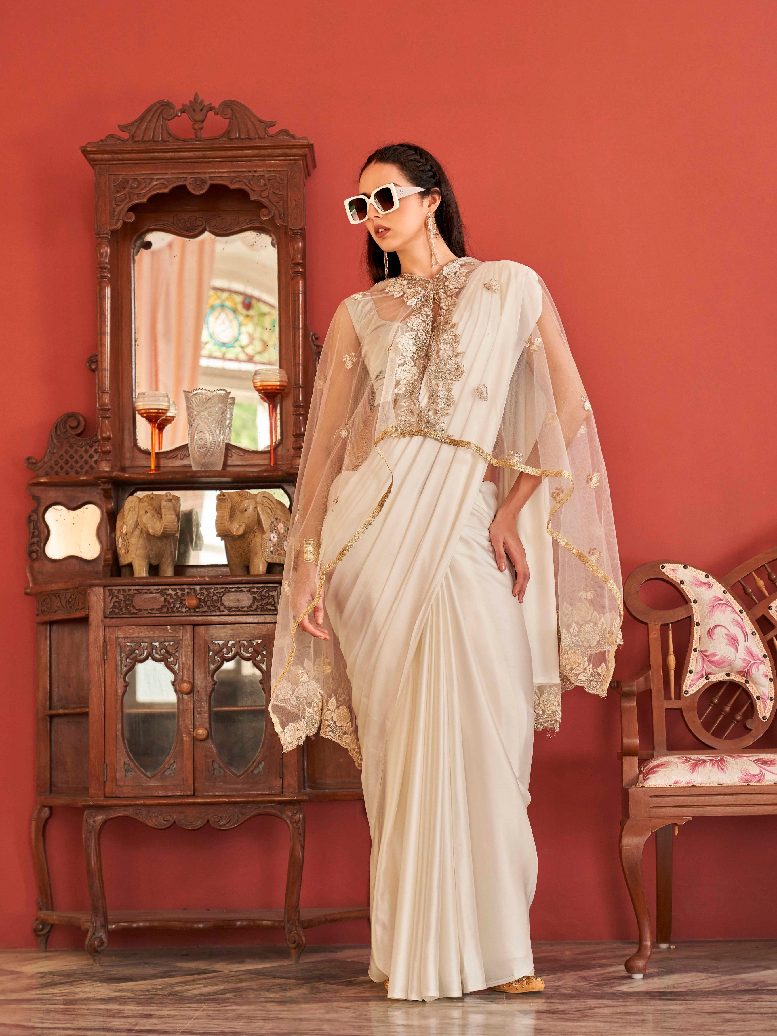 White colored designer saree with dupatta which can be draped multiple ways