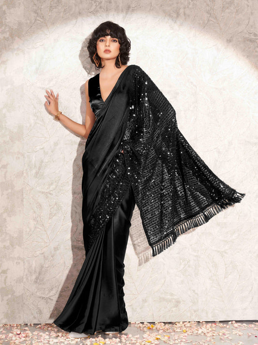 Black colored designer sequence embroidered satin saree with tassles on pallu