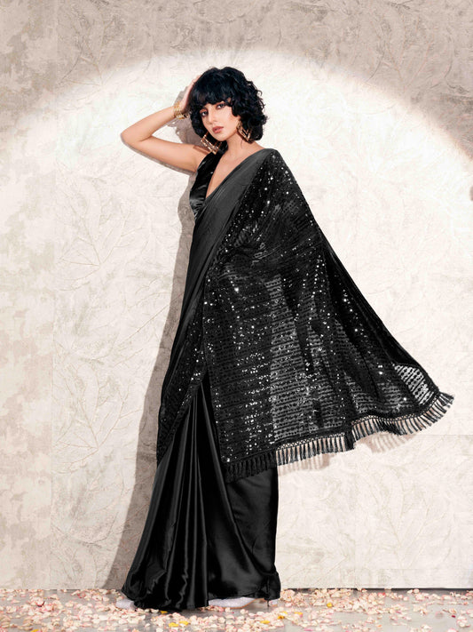 Black colored designer sequence embroidered satin saree with tassles on pallu