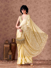 Beige colored designer sequence embroidered satin saree with tassles on pallu