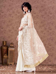 Off white colored net and satin half and half embroidered saree