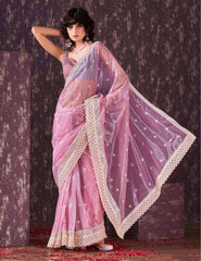 Pink colored supernet saree with faux mirror embroidery and crochet lace