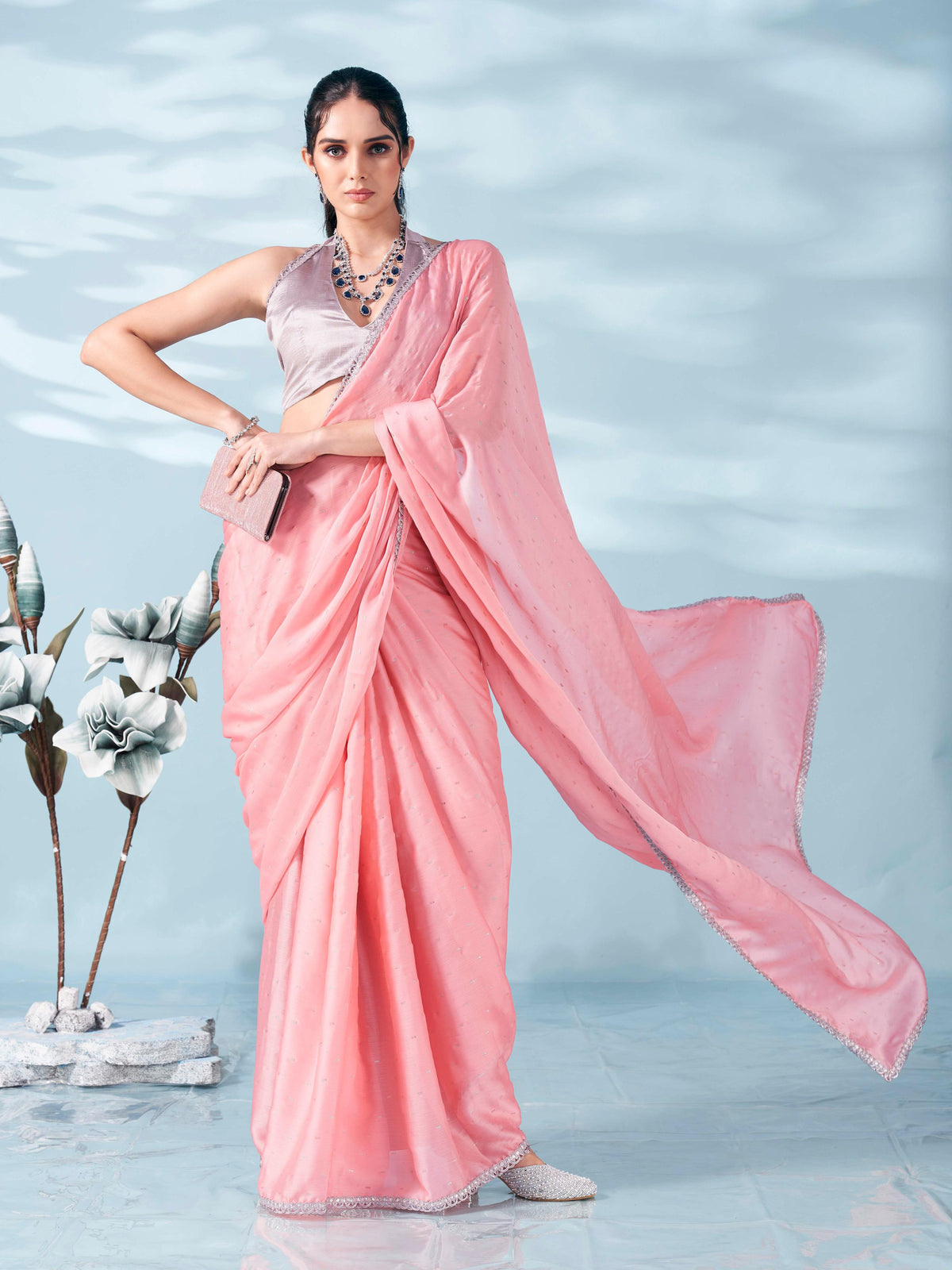 Peach colored satin foil printed saree with embellished lace