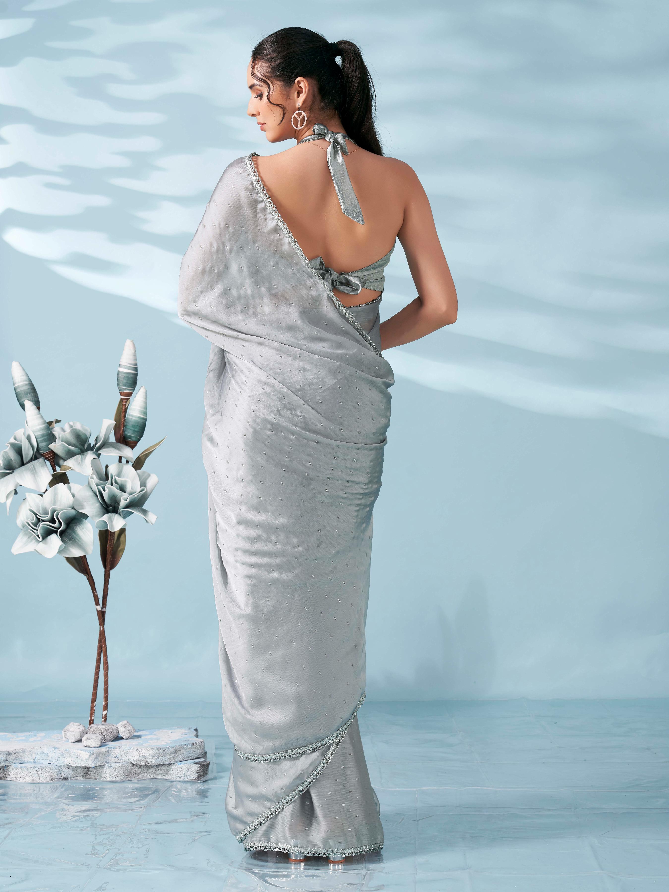 Silver colored satin foil printed saree with embellished lace