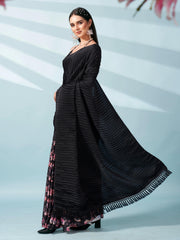 Black colored digital floral print half and half crepe saree with tassle in pallu