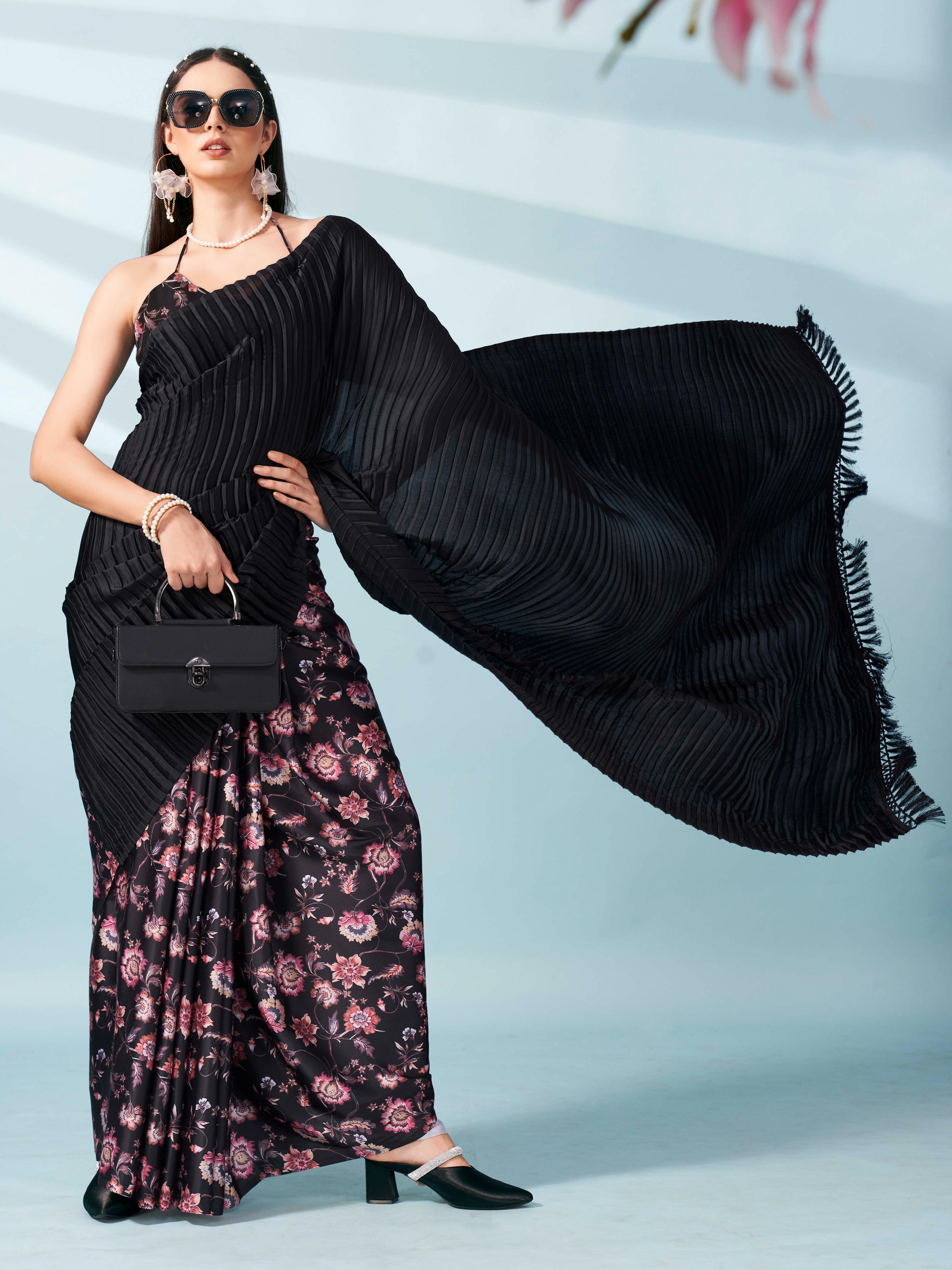 Black colored digital floral print half and half crepe saree with tassle in pallu