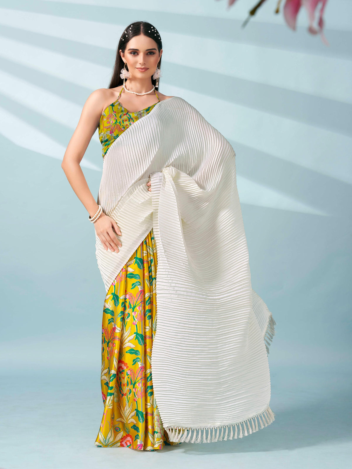 Cream and yellow colored digital floral print half and half crepe saree with tassle in pallu