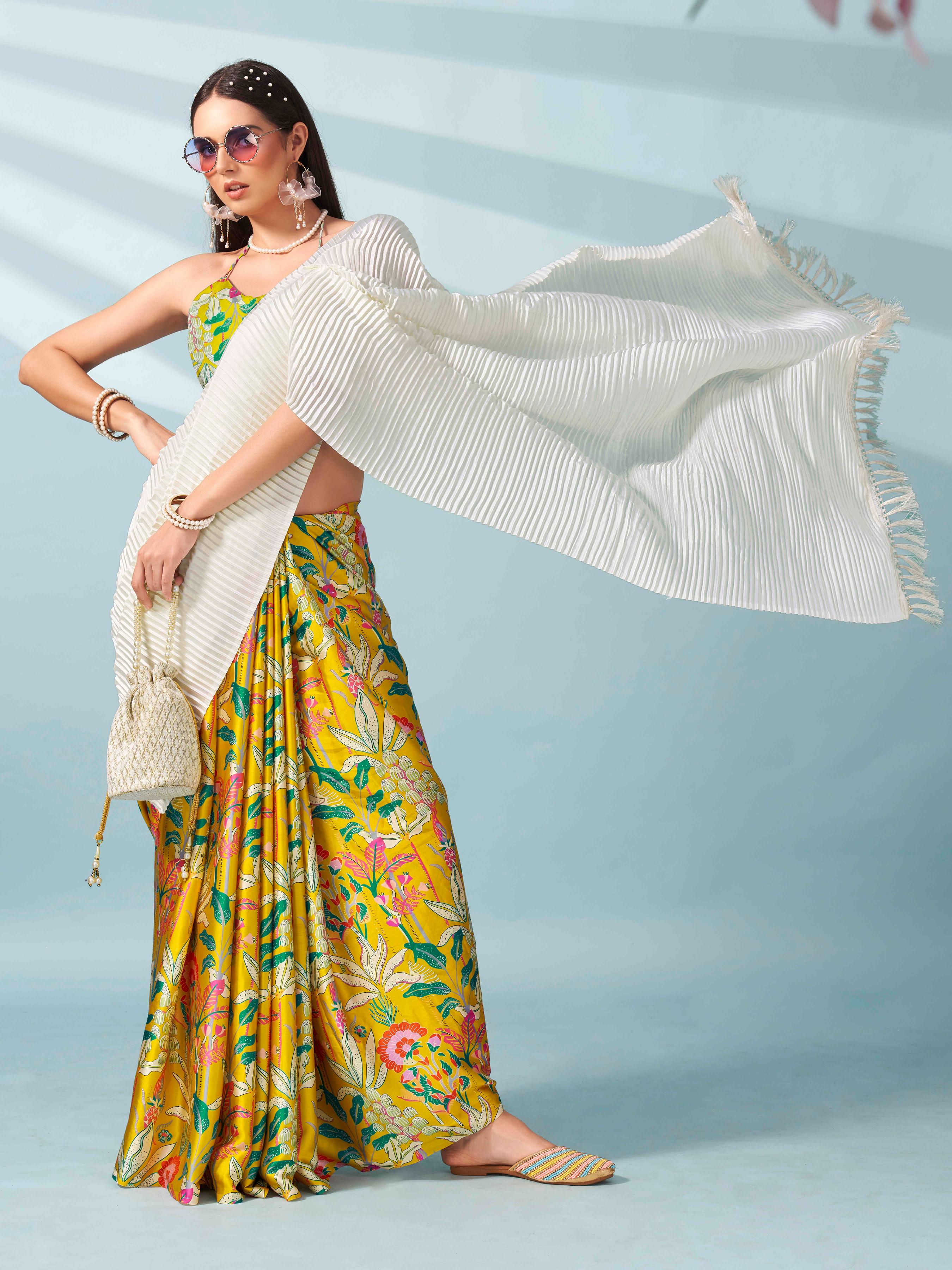 Cream and yellow colored digital floral print half and half crepe saree with tassle in pallu