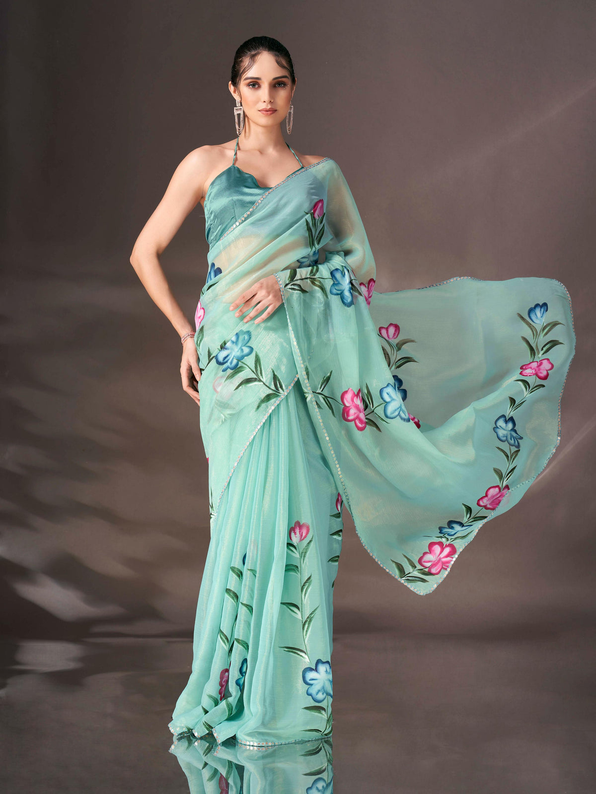 Sea green colored shimmer chiffon saree with hand print and scalloped border