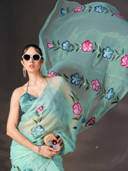 Sea green colored shimmer chiffon saree with hand print and scalloped border