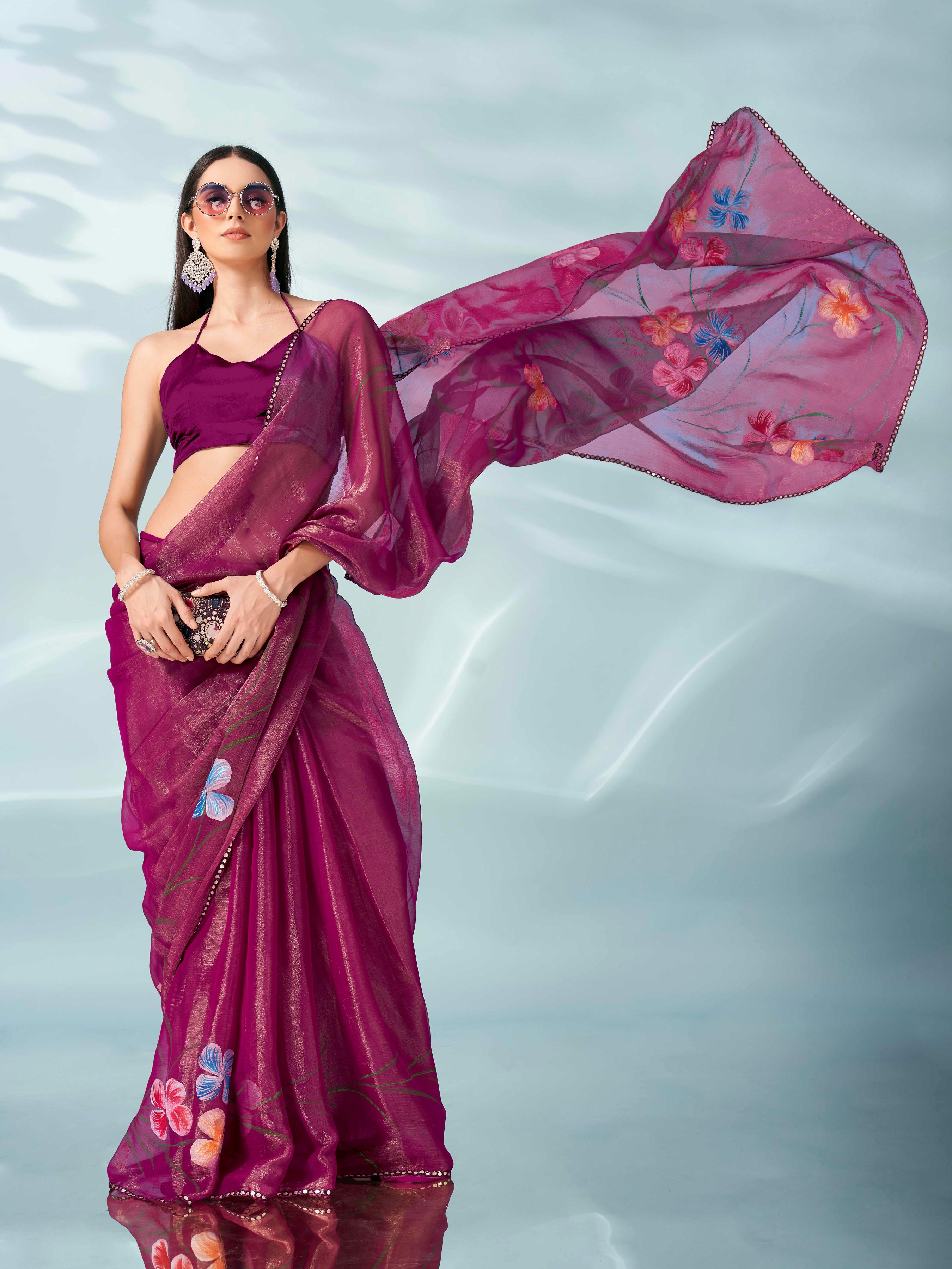 Rani colored shimmer chiffon saree with hand print and scalloped border