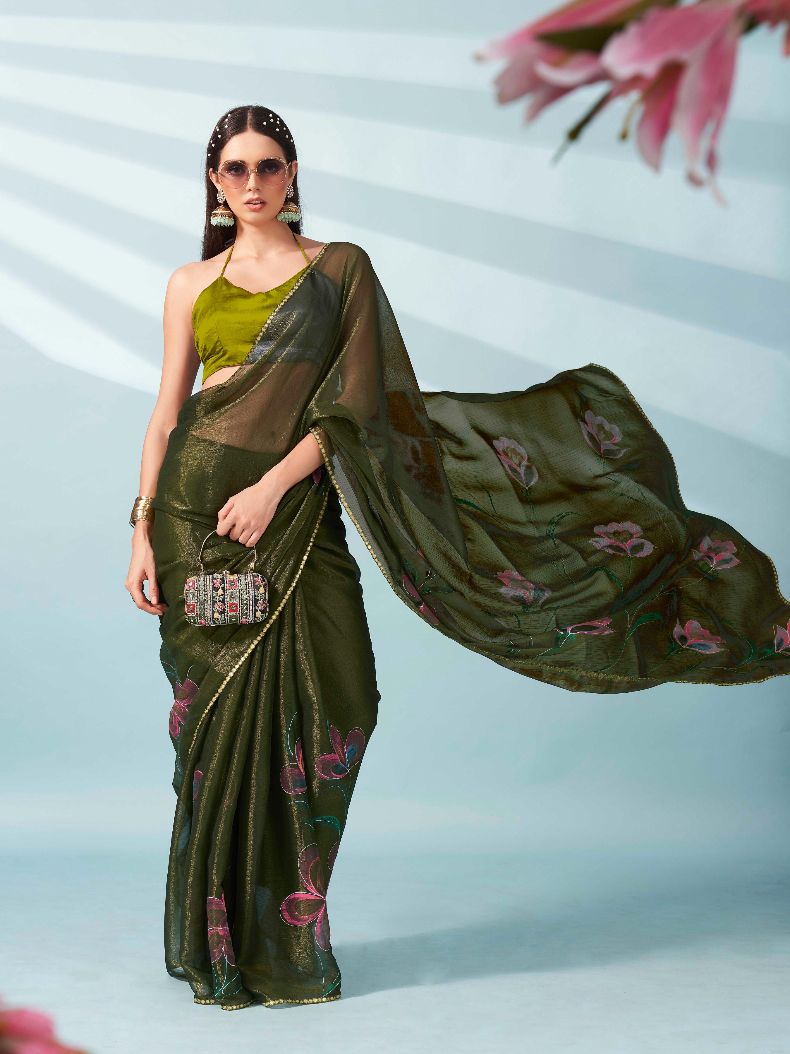 Green colored shimmer chiffon saree with hand print and scalloped border